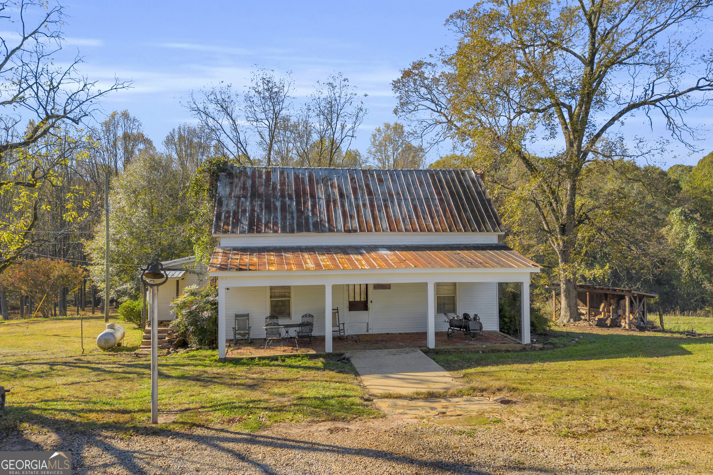 1129 Lord Road Commerce, GA 30530 - Photo 7 of 30 a view of a house with swimming pool and sitting area