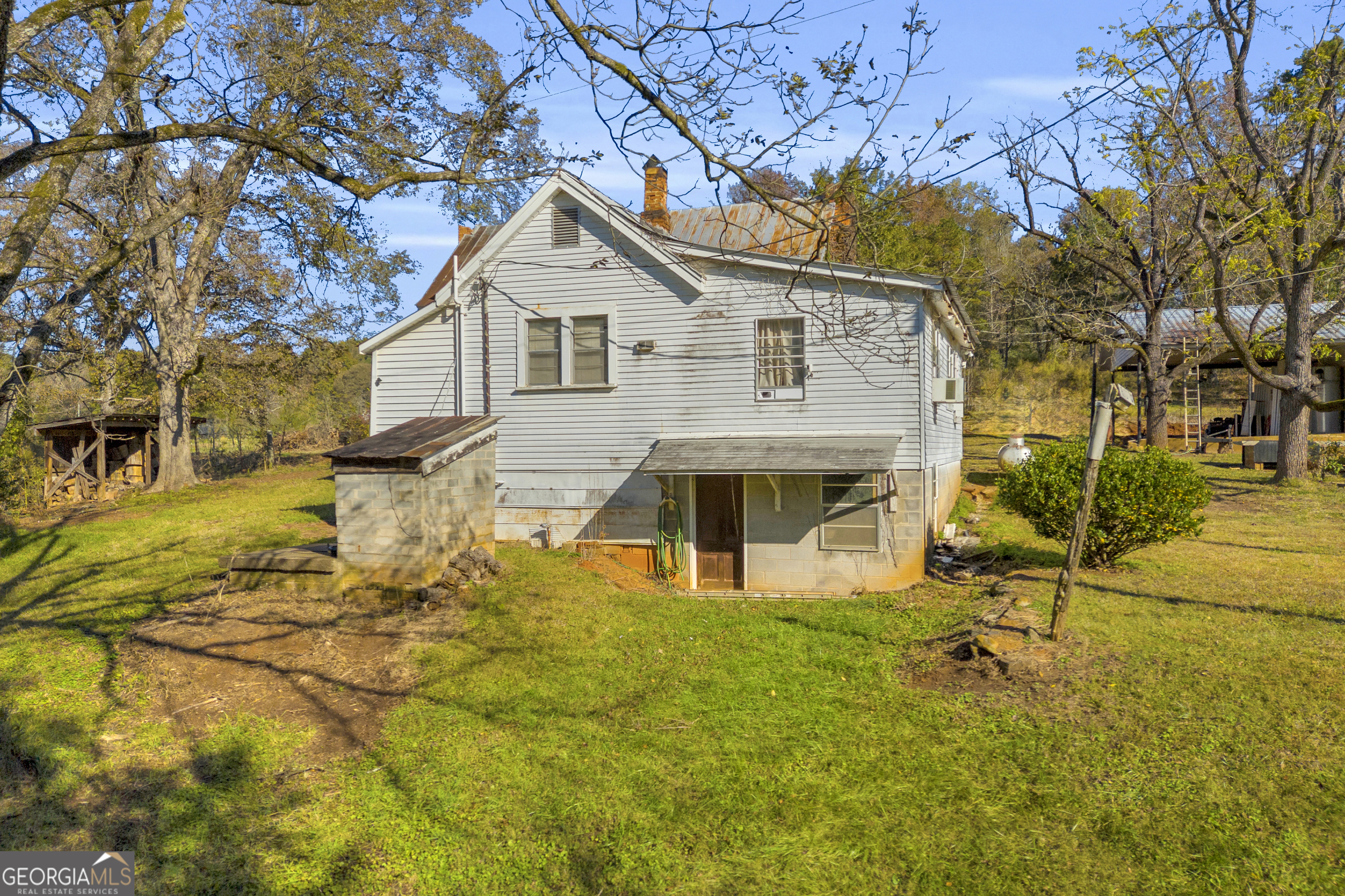 1129 Lord Road Commerce, GA 30530 - Photo 9 of 30 a front view of a house with a yard