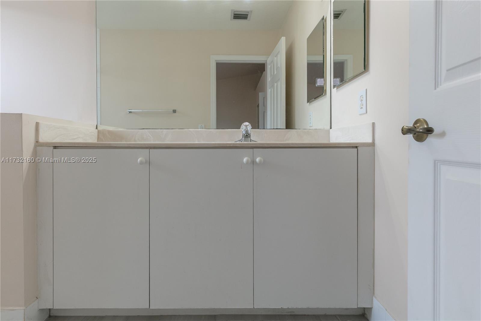 Spring Tree Sunrise, FL 33351 - Photo 17 of 44 a bathroom with a sink and mirror