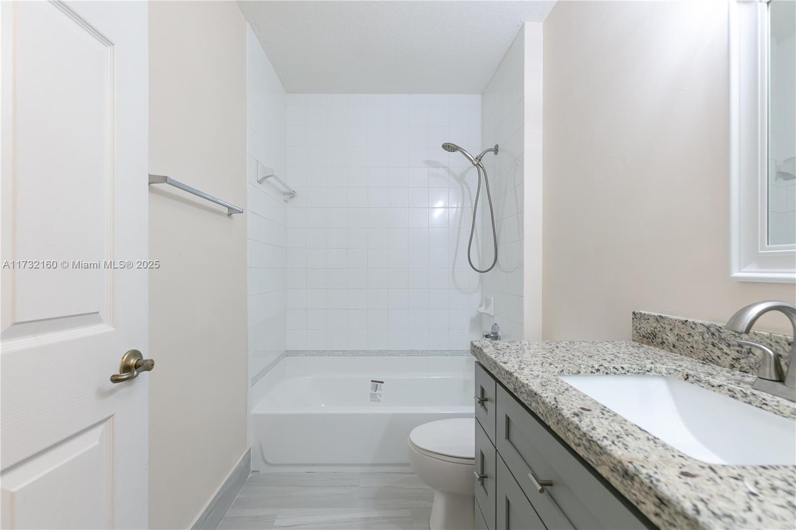 Spring Tree Sunrise, FL 33351 - Photo 23 of 44 a bathroom with a granite countertop sink a toilet and shower