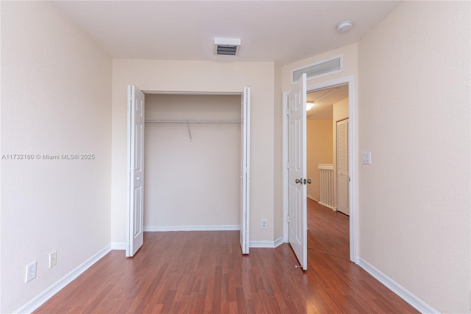 Spring Tree Sunrise, FL 33351 - Photo 30 of 44 a view of a hallway with wooden floor