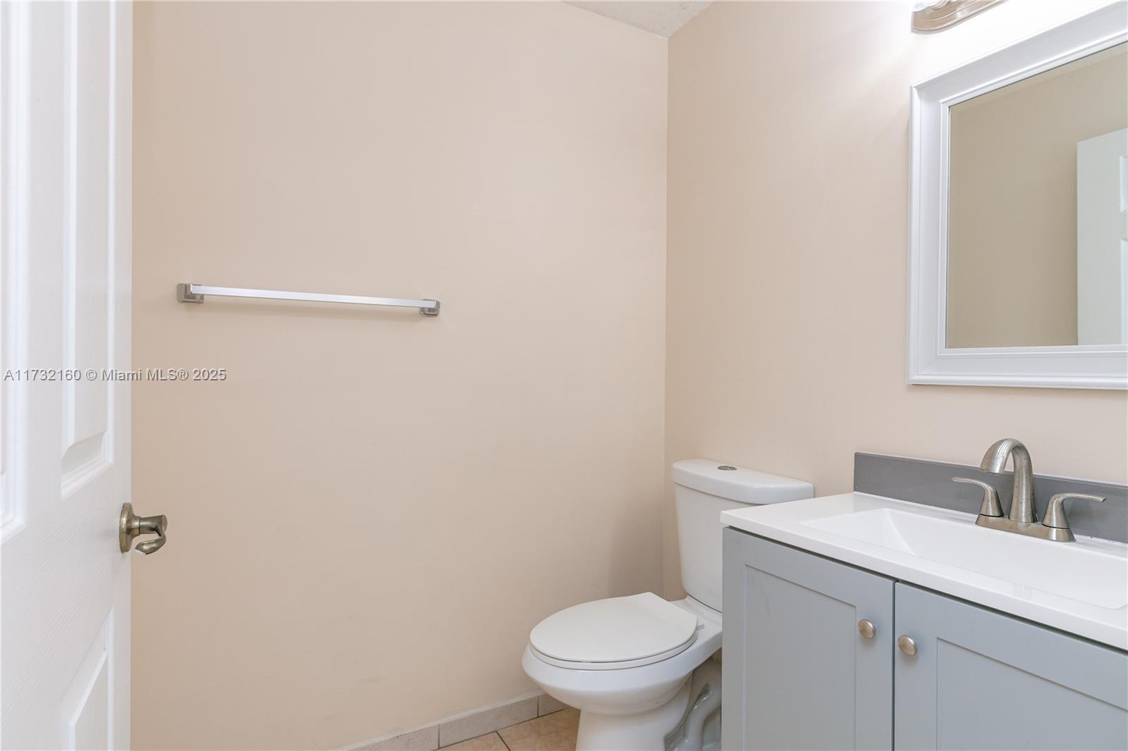 Spring Tree Sunrise, FL 33351 - Photo 32 of 44 a bathroom with a sink a toilet and a mirror