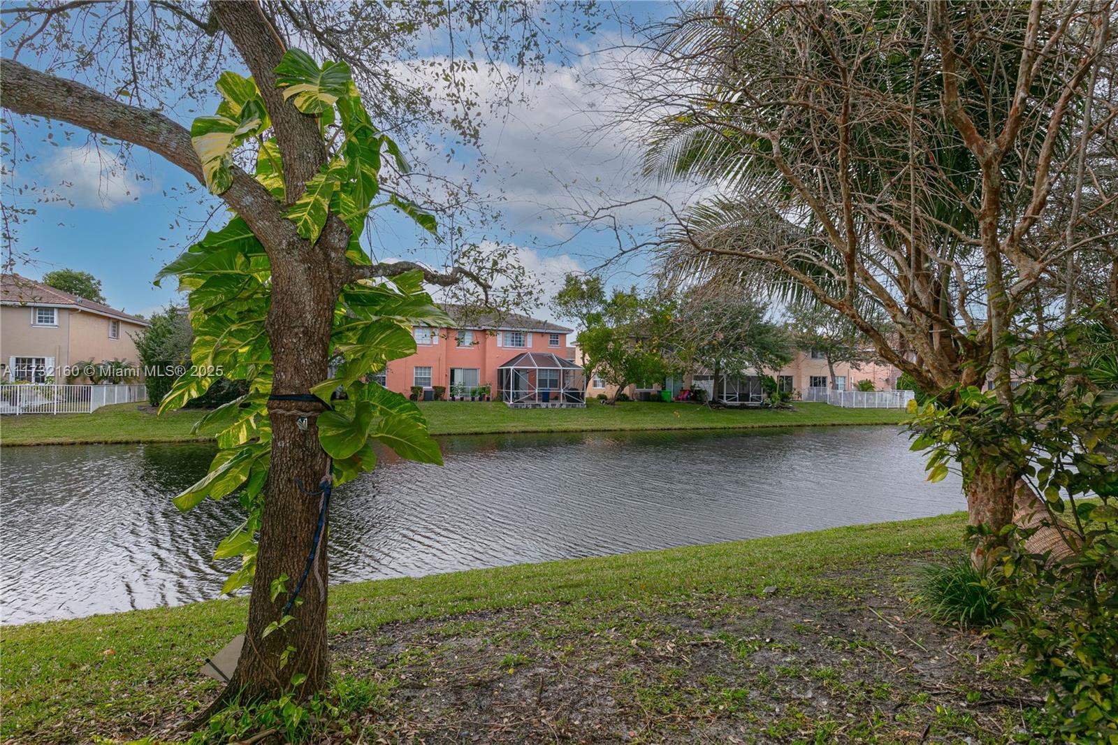 Spring Tree Sunrise, FL 33351 - Photo 34 of 44 a view of a lake with a park