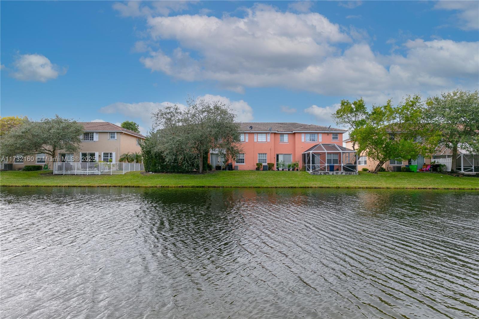 Spring Tree Sunrise, FL 33351 - Photo 37 of 44 a view of a golf course with a lake