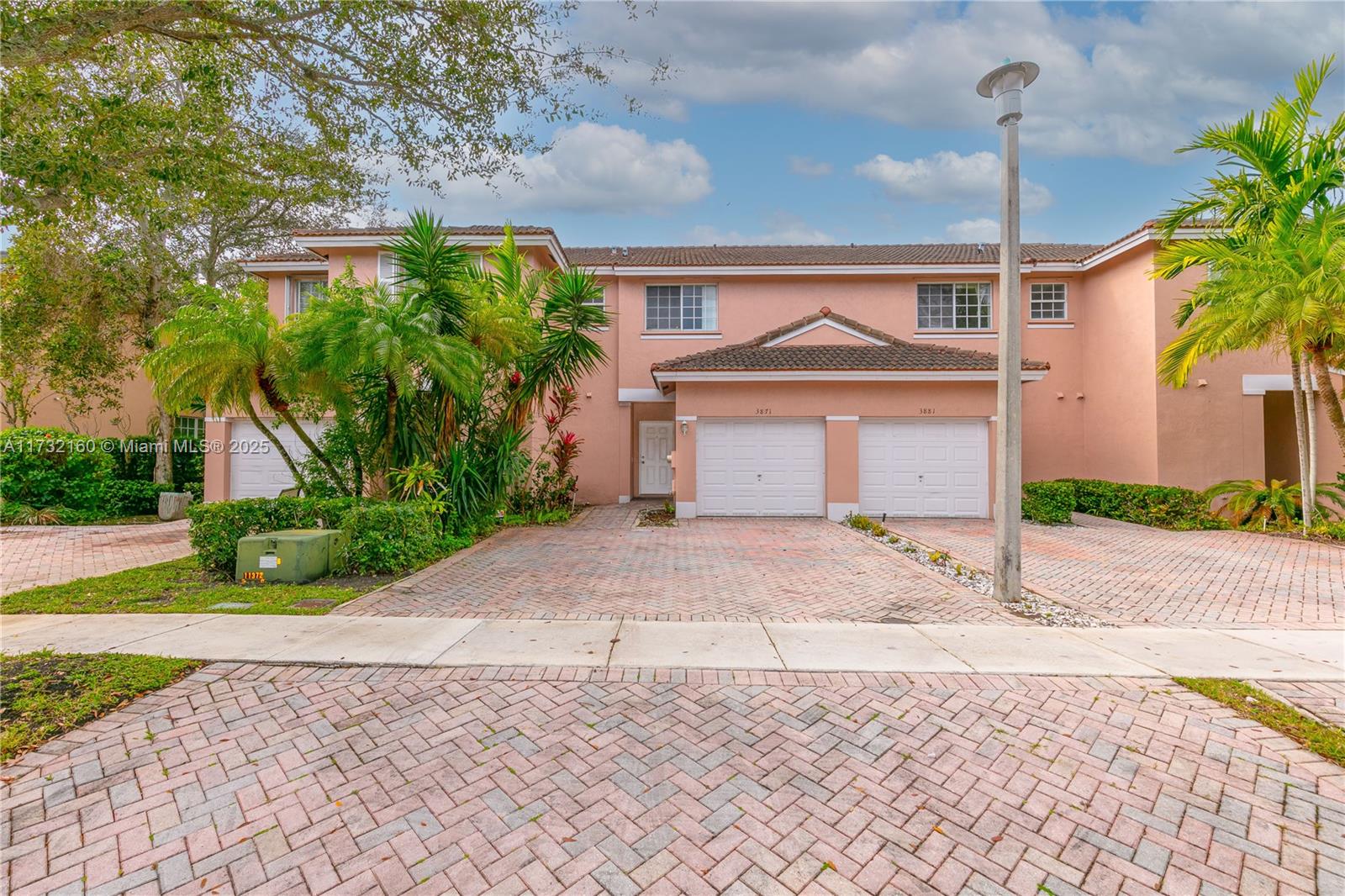 Spring Tree Sunrise, FL 33351 - Photo 38 of 44 a front view of a house with a yard and garage