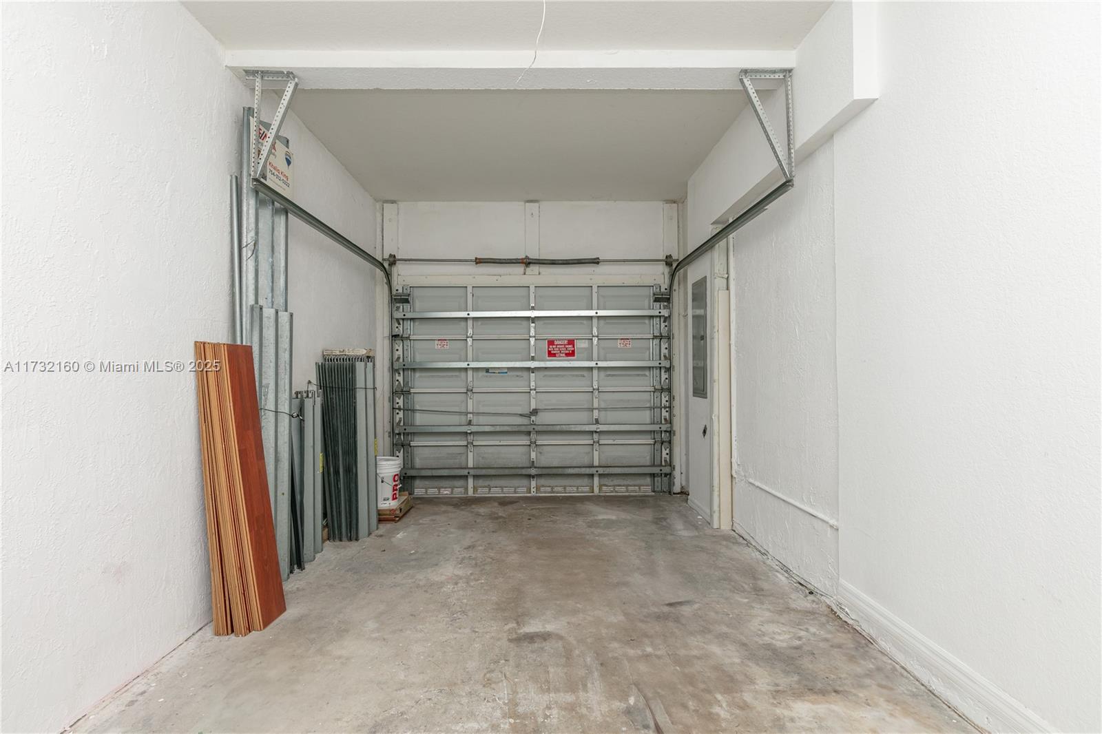 Spring Tree Sunrise, FL 33351 - Photo 43 of 44 a view of walk in closet with empty racks