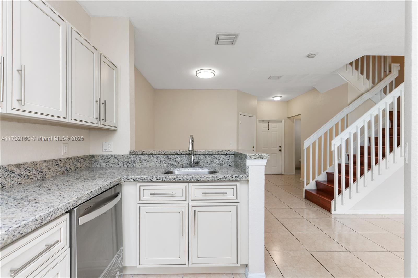 Spring Tree Sunrise, FL 33351 - Photo 7 of 44 a kitchen with stainless steel appliances granite countertop a sink and cabinets