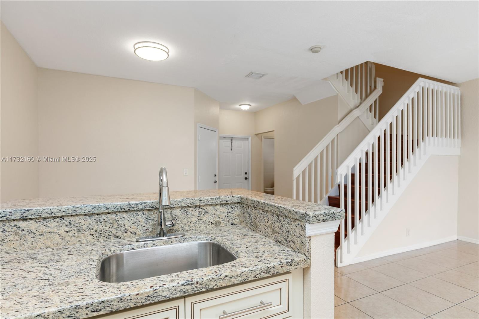 Spring Tree Sunrise, FL 33351 - Photo 8 of 44 a kitchen with sink cabinets and stove