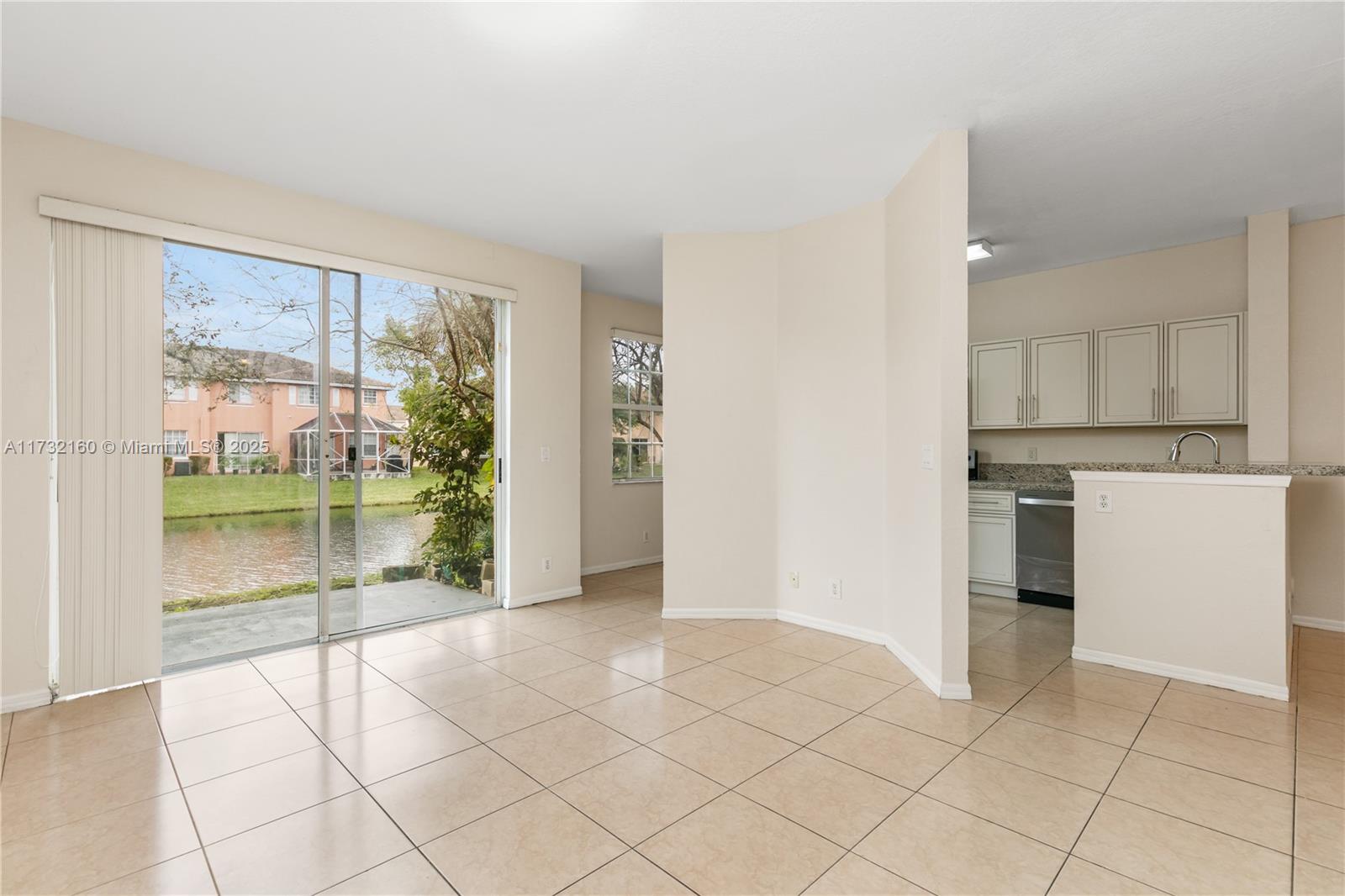 Spring Tree Sunrise, FL 33351 - Photo 9 of 44 a view of a kitchen with a sink and a refrigerator
