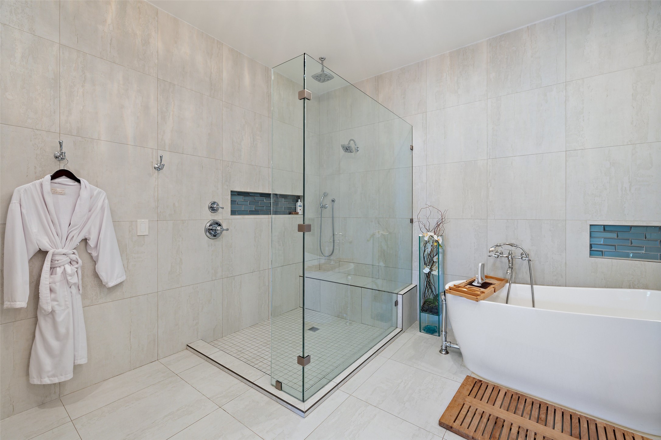 2412 Bee Creek Road Spicewood, TX 78669 - Photo 17 of 40 a bathroom with a bathtub and shower