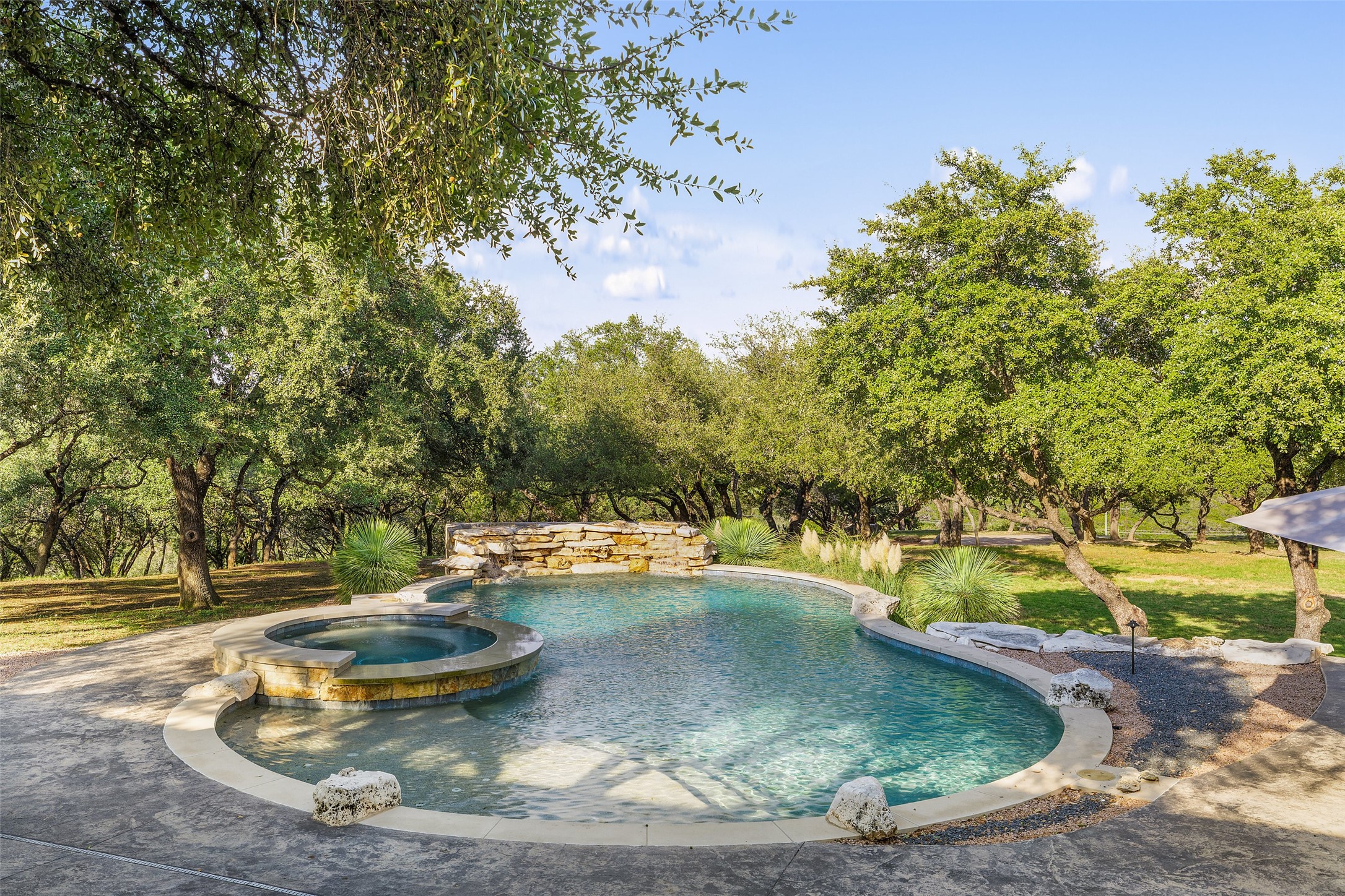 2412 Bee Creek Road Spicewood, TX 78669 - Photo 20 of 40 a view of a water fountain in a yard