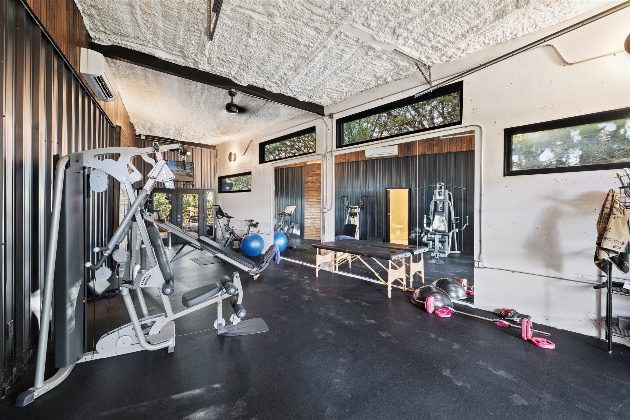 2412 Bee Creek Road Spicewood, TX 78669 - Photo 24 of 40 a view of a room with gym equipment