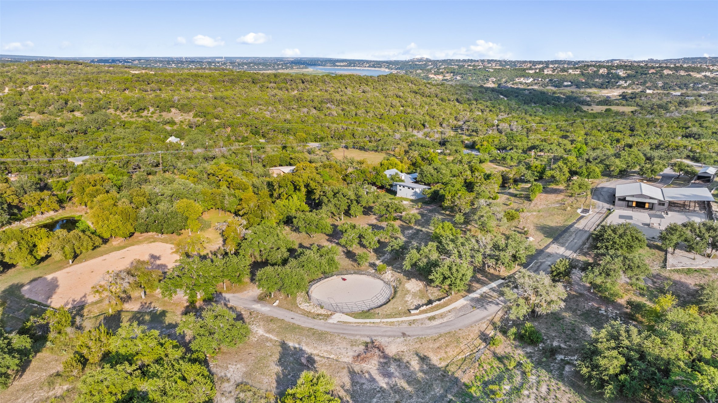2412 Bee Creek Road Spicewood, TX 78669 - Photo 34 of 40 a view of a lake with a city