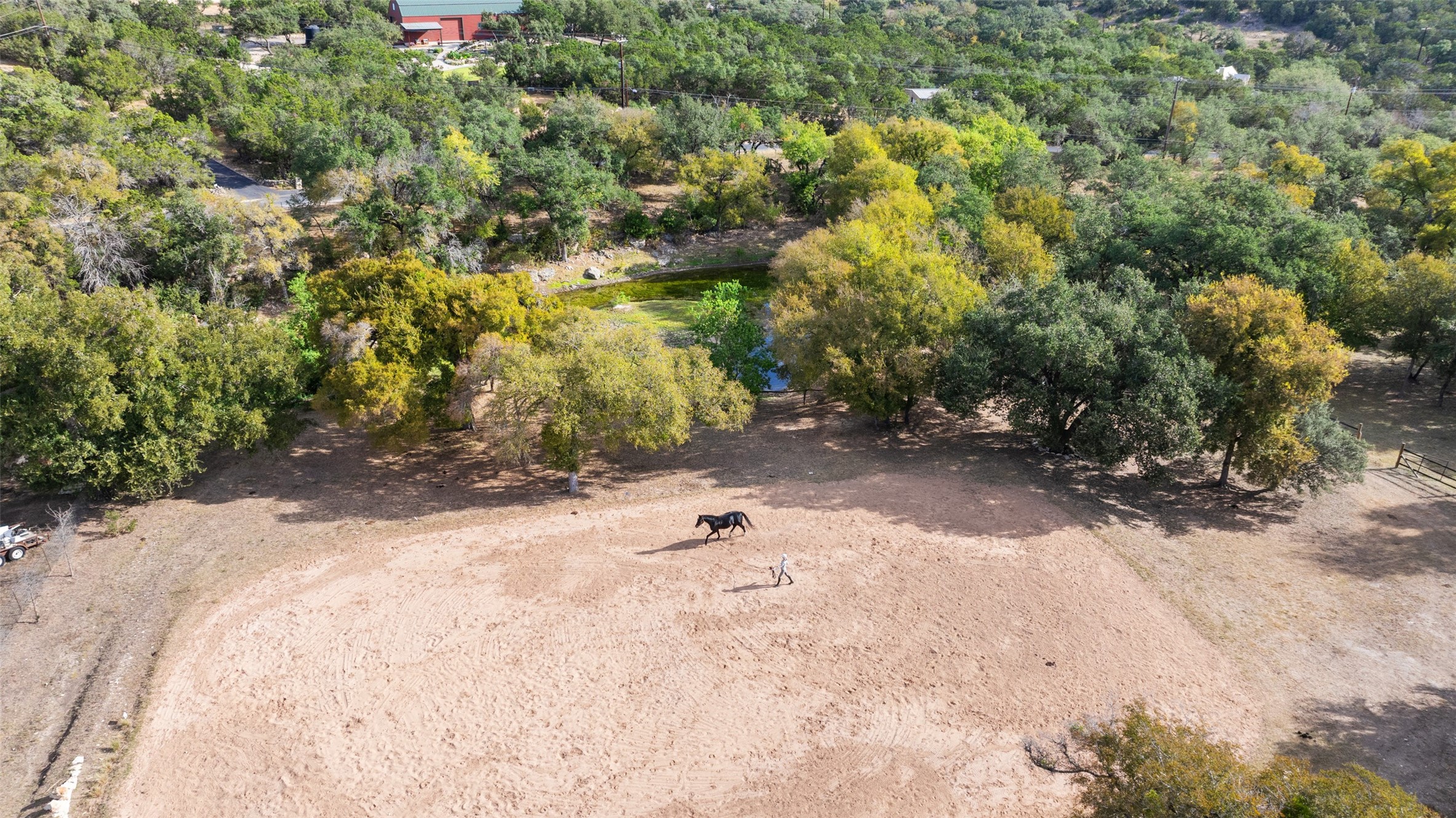 2412 Bee Creek Road Spicewood, TX 78669 - Photo 35 of 40 a backyard of a house with yard and trees