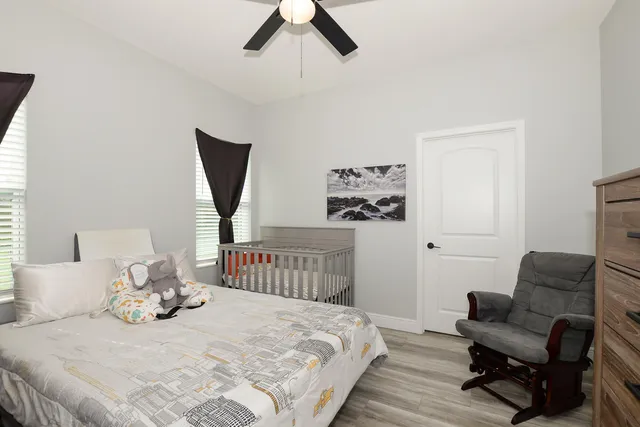 a bedroom with a bed and chair