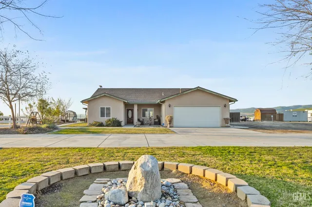 a view of a room with gym equipment and a large window