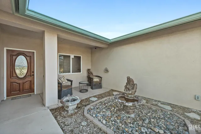 a kitchen with stainless steel appliances kitchen island granite countertop a sink and cabinets