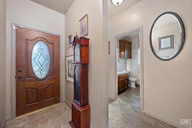 a kitchen with granite countertop a sink stainless steel appliances and cabinets