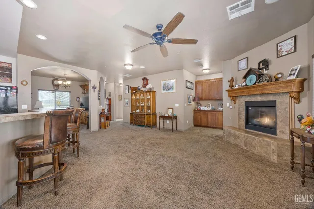 a kitchen with granite countertop a sink and a stove top oven