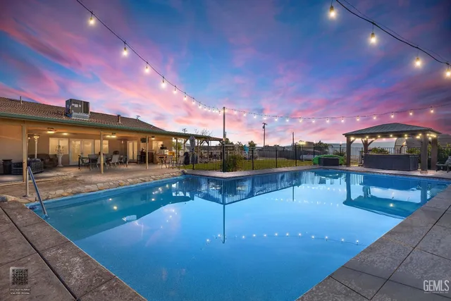 an aerial view of a house with a swimming pool