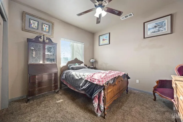 a swimming pool with outdoor seating and yard