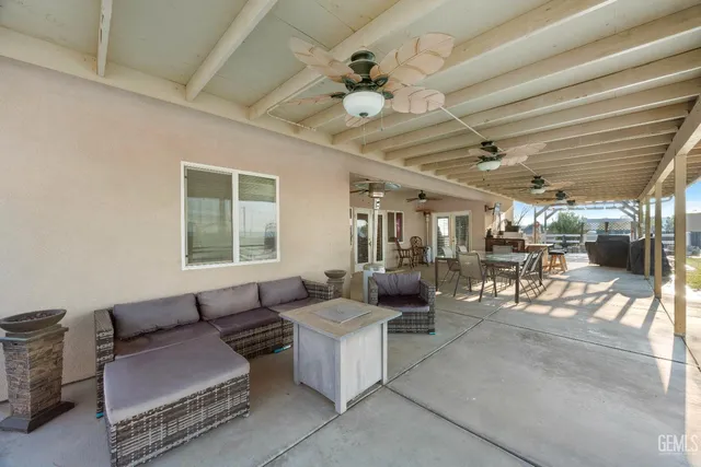 a view of a lake with a table and chairs