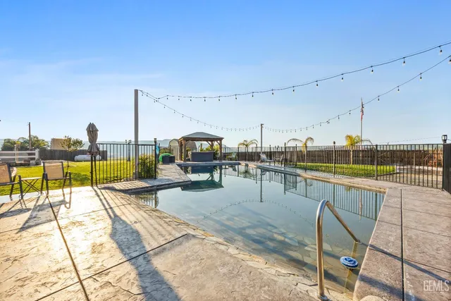 a view of a swimming pool with a garden