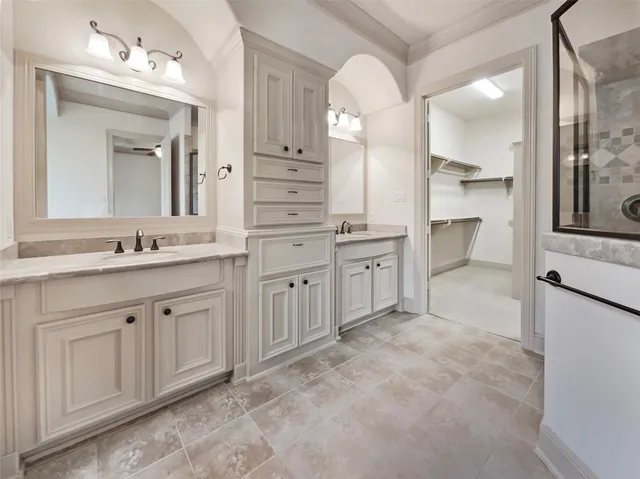 a spacious bathroom with a granite countertop sink mirror and