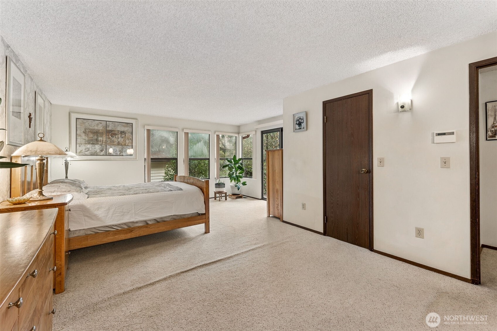 34609 4th Place South Federal Way, WA 98003 - Photo 21 of 38 a spacious bedroom with a large bed and a dresser
