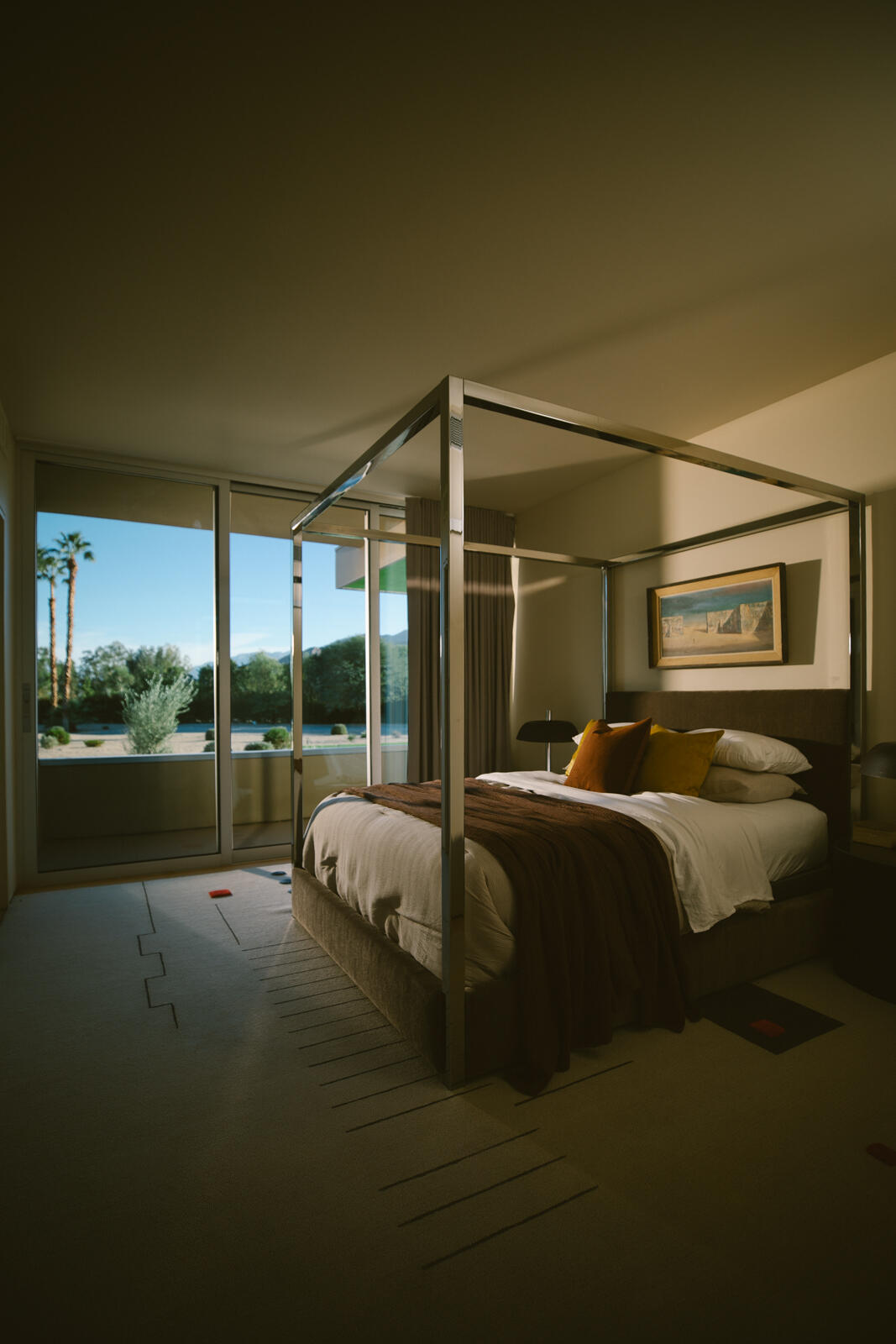 38850 Kelly Lane Rancho Mirage, CA 92270 - Photo 21 of 34 a bed sitting in a bedroom next to a large window