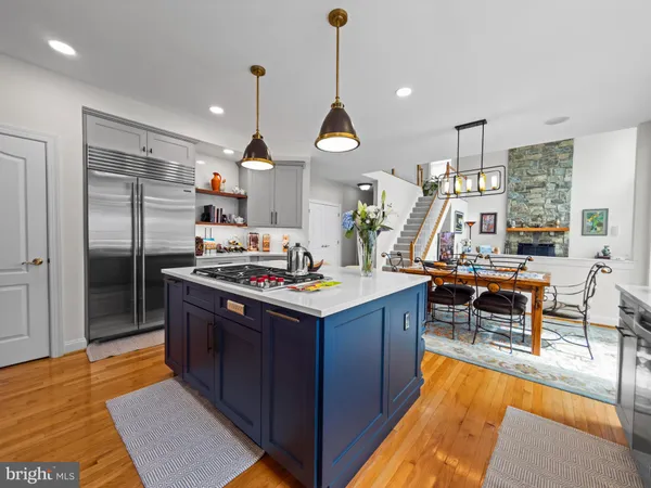 a kitchen with a stove and a white cabinets