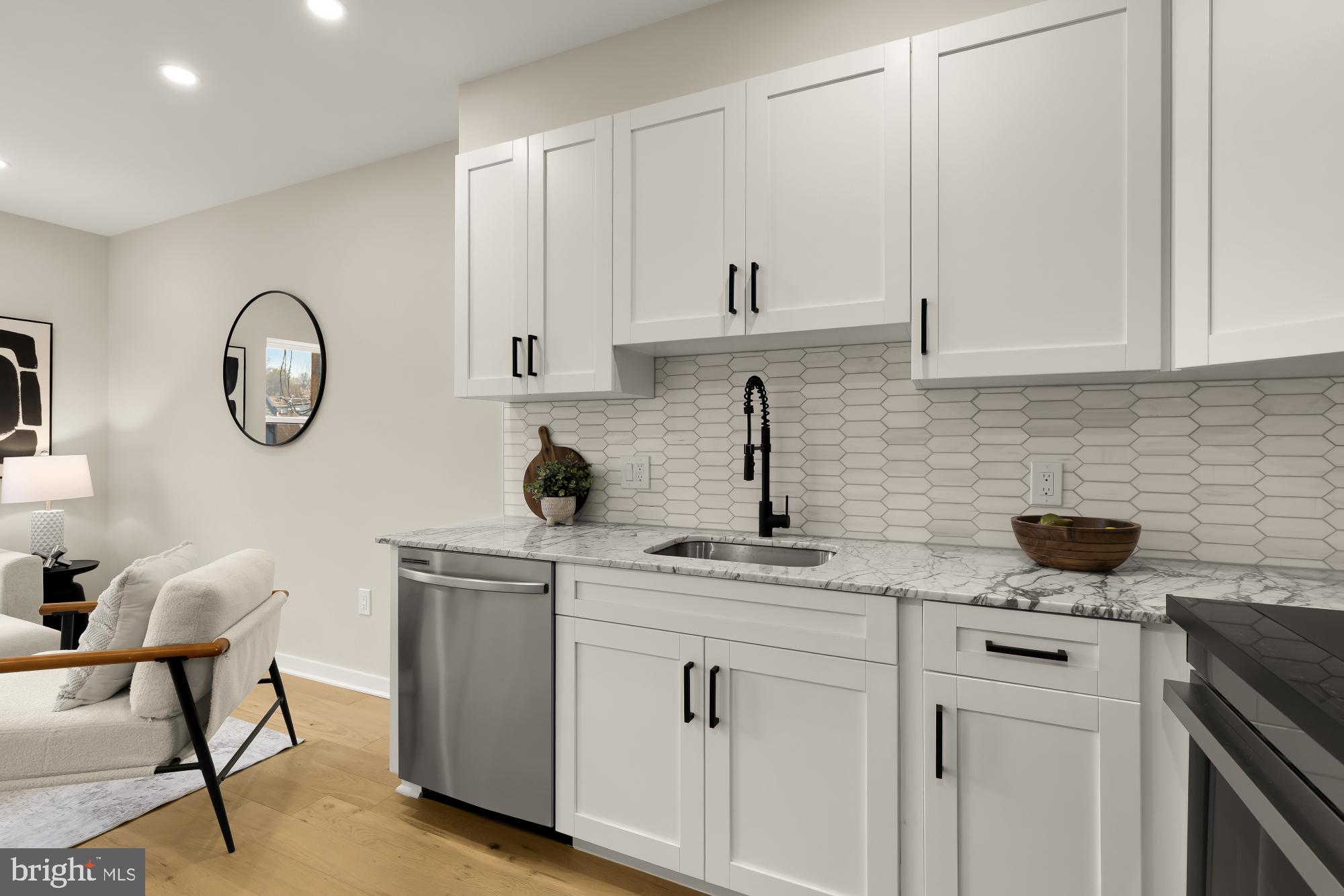 2606 41st Street Northwest, Unit 6 Washington, DC 20007 - Photo 11 of 25 a kitchen with cabinets stainless steel appliances and a sink
