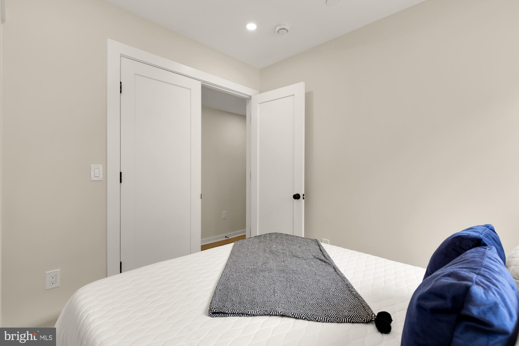 2606 41st Street Northwest, Unit 6 Washington, DC 20007 - Photo 19 of 25 a bedroom with a bed and a closet