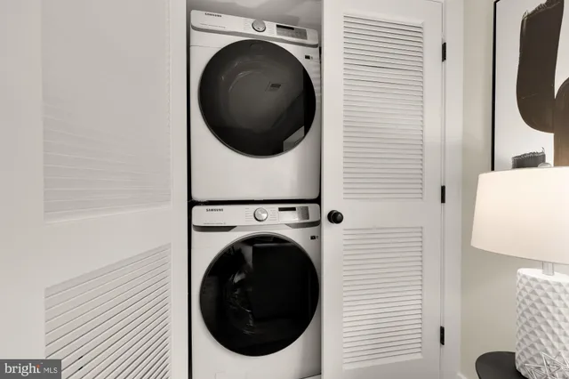 a view of a hallway with washer and dryer
