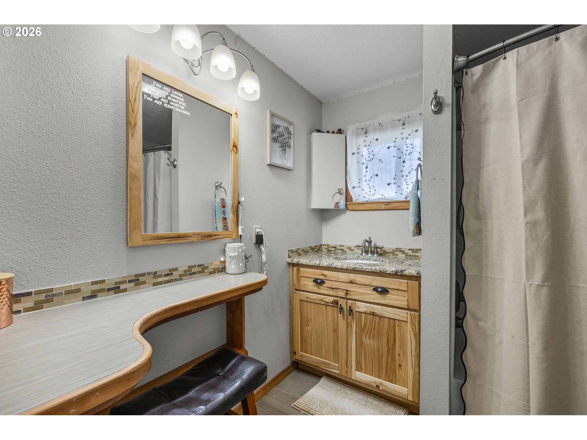 27374 Bumpy Road John Day, OR 97845 - Photo 24 of 45 a bathroom with a sink a mirror and a toilet