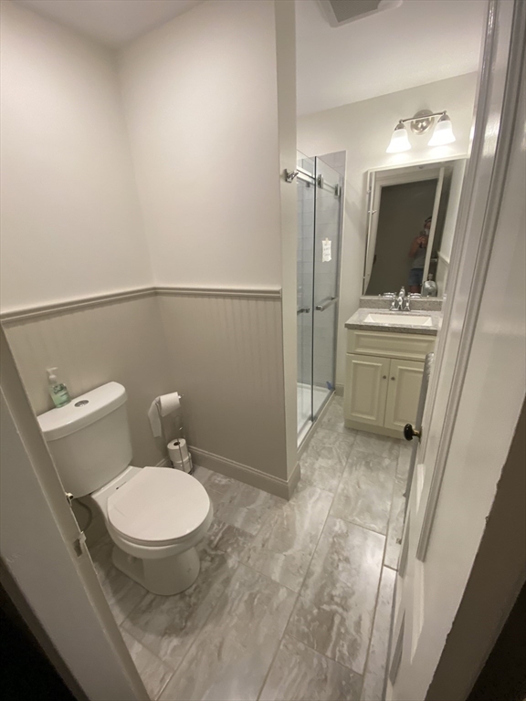93 Beacon Street, Unit 55 Boston, MA 02108 - Photo 7 of 7 a bathroom with a sink toilet and shower