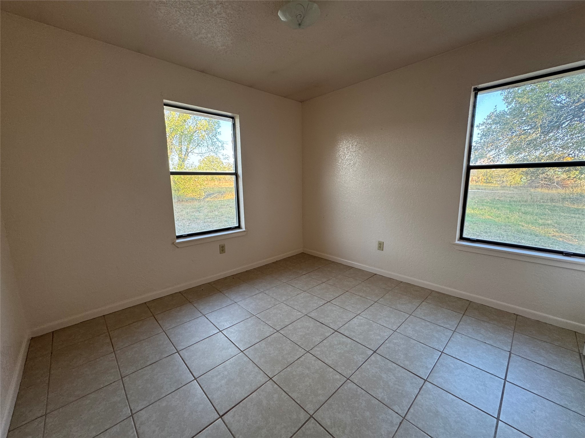 163 Robinson Road Lockhart, TX 78644 - Photo 11 of 21 an empty room with windows