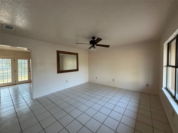 a view of an empty room and window