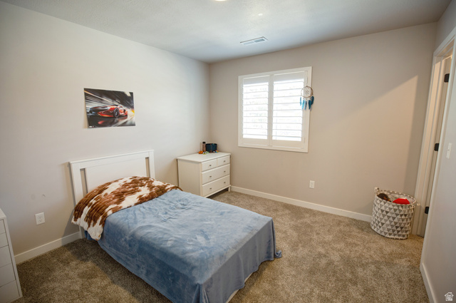 983 South 950 West Provo, UT 84601 - Photo 42 of 56 Carpeted room with a window featuring white plantation shutters, white baseboards, and neutral wall paint