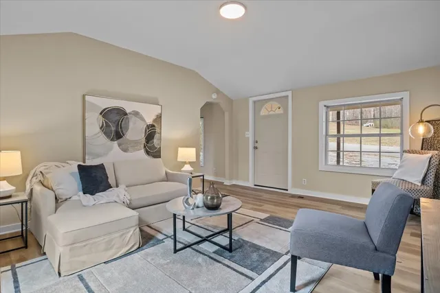 a living room with furniture and a window