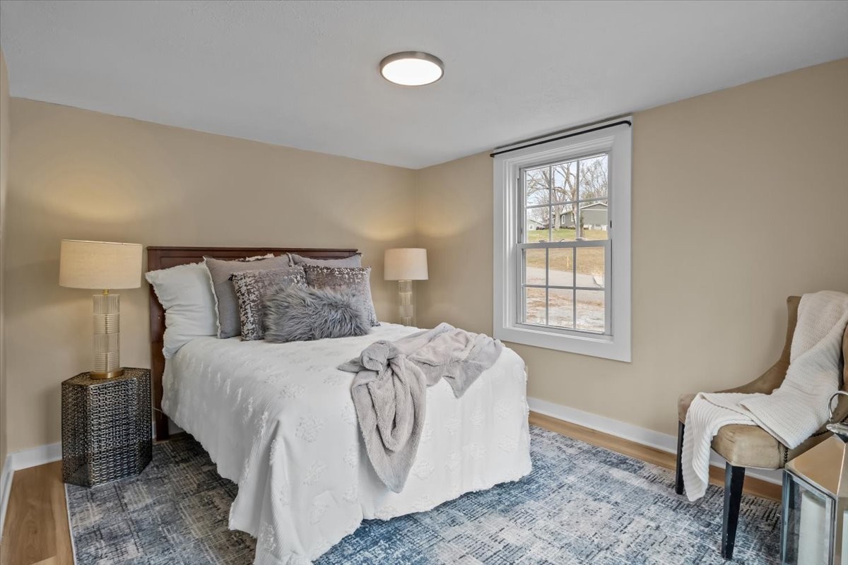 370 Main Street White Bluff, TN 37187 - Photo 11 of 29 a bedroom with bed and chair with window
