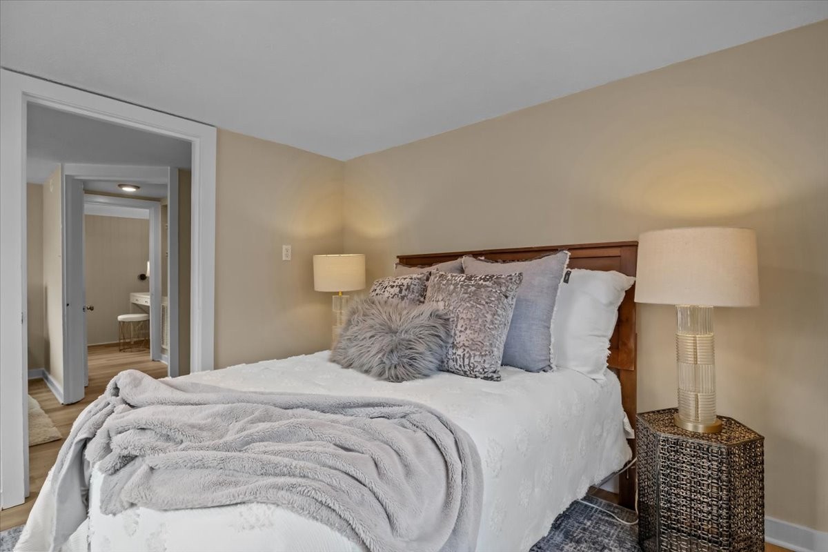 370 Main Street White Bluff, TN 37187 - Photo 12 of 29 a bedroom with a bed and wooden floor