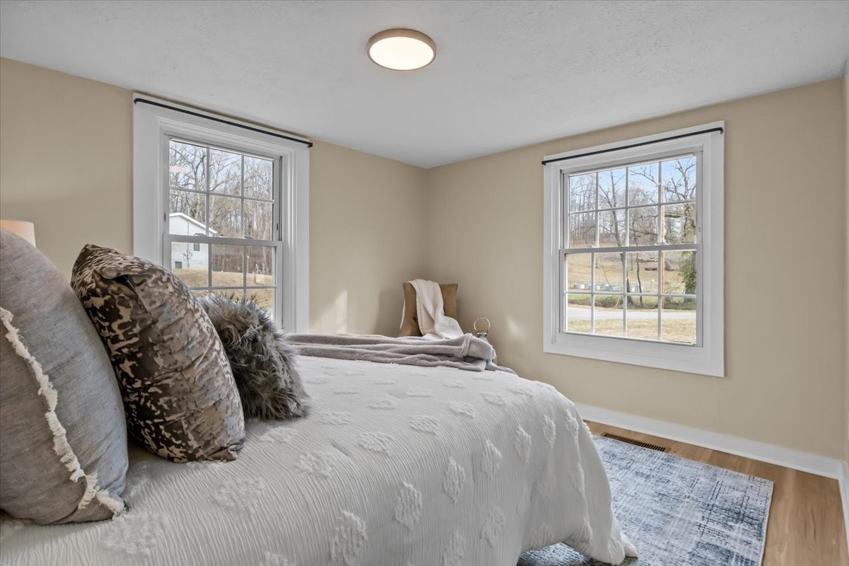 370 Main Street White Bluff, TN 37187 - Photo 13 of 29 a bed sitting in a bedroom next to a window