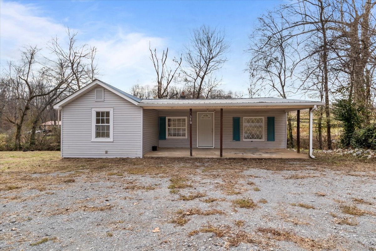 370 Main Street White Bluff, TN 37187 - Photo 21 of 29 a front view of a house with a garden