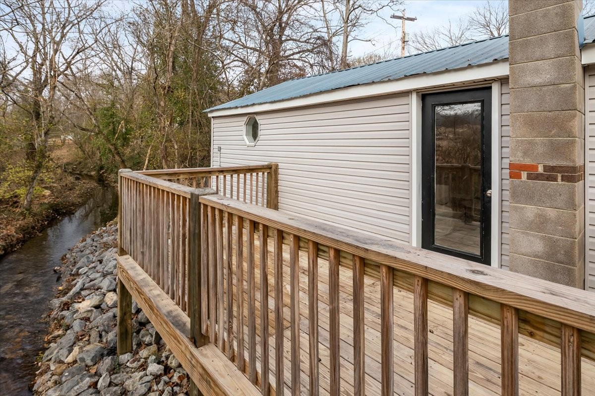 370 Main Street White Bluff, TN 37187 - Photo 28 of 29 a view of a balcony with wooden floor and fence
