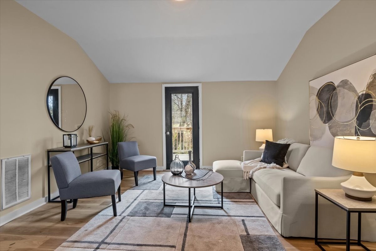 370 Main Street White Bluff, TN 37187 - Photo 3 of 29 a living room with furniture a mirror and a potted plant