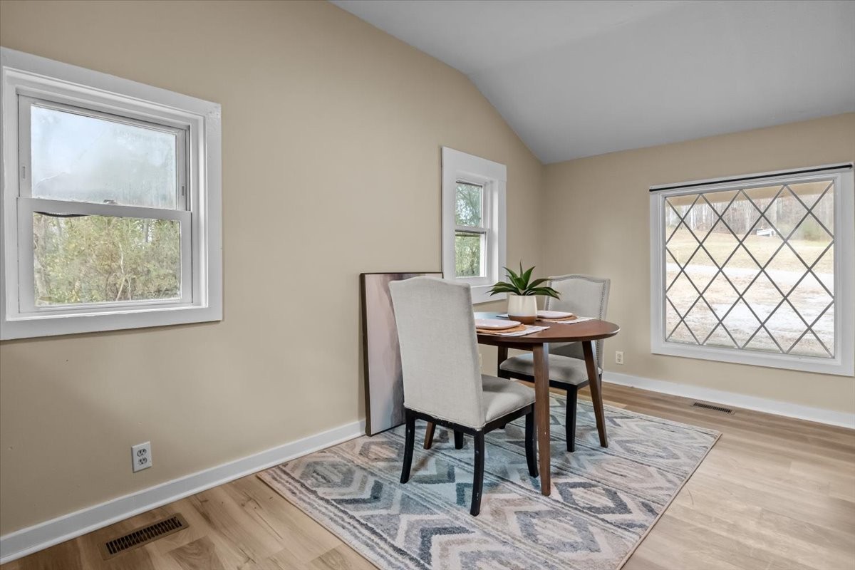 370 Main Street White Bluff, TN 37187 - Photo 10 of 29 a view of a dining room with furniture window and wooden floor