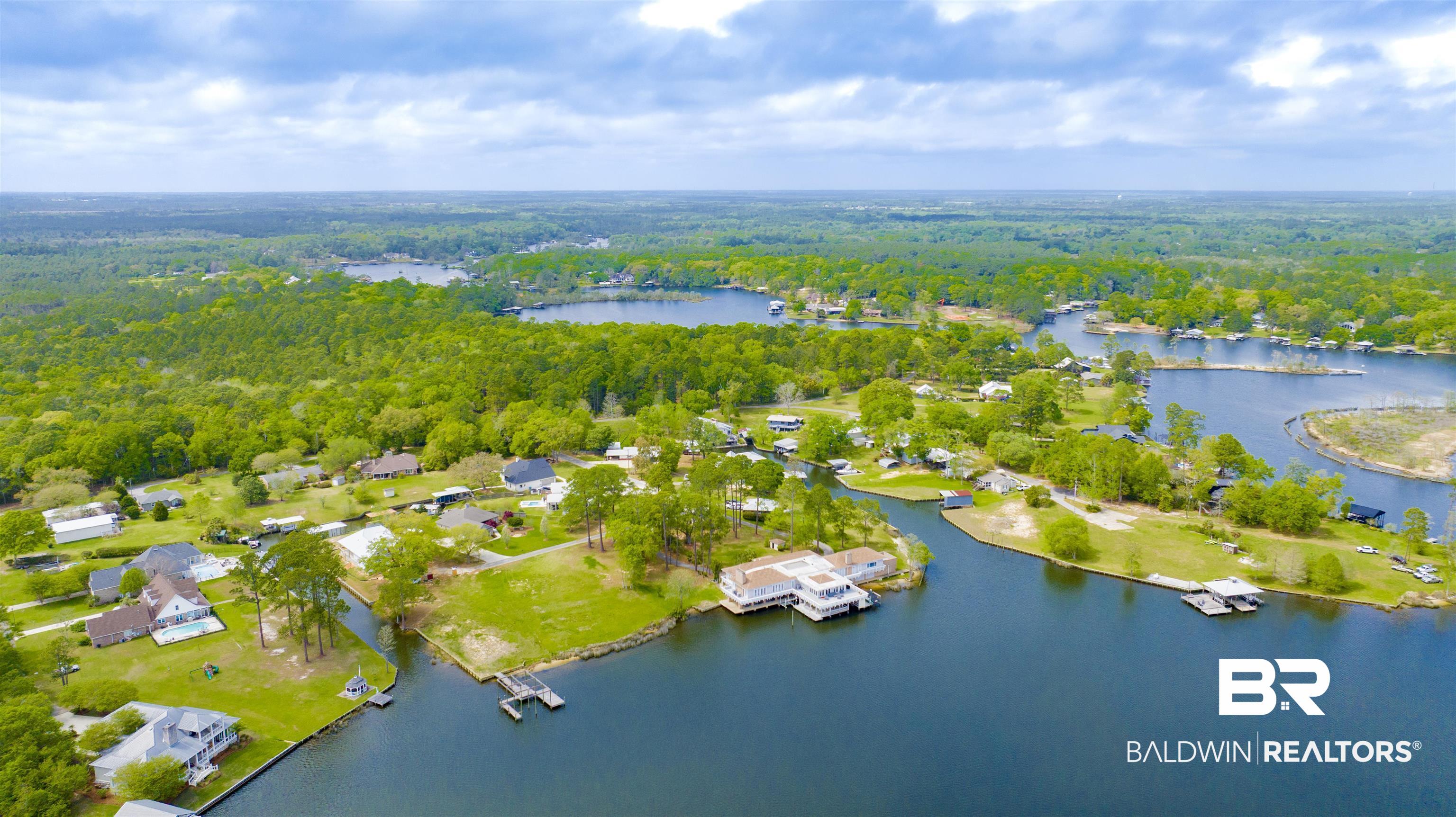 0 South Windsor Road South Theodore, AL 36582 - Photo 19 of 22 Bird's eye view of a heavily wooded area and a nearby body of water