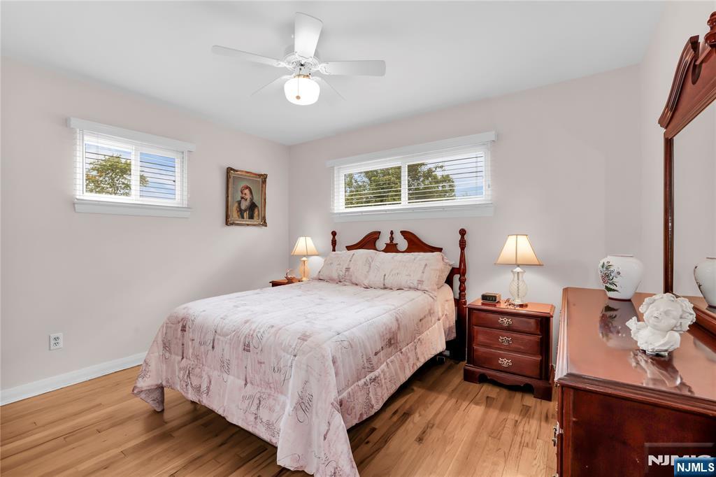 23 Ridge Court Cedar Grove, NJ 07009 - Photo 23 of 37 a bedroom with a bed and wooden floor