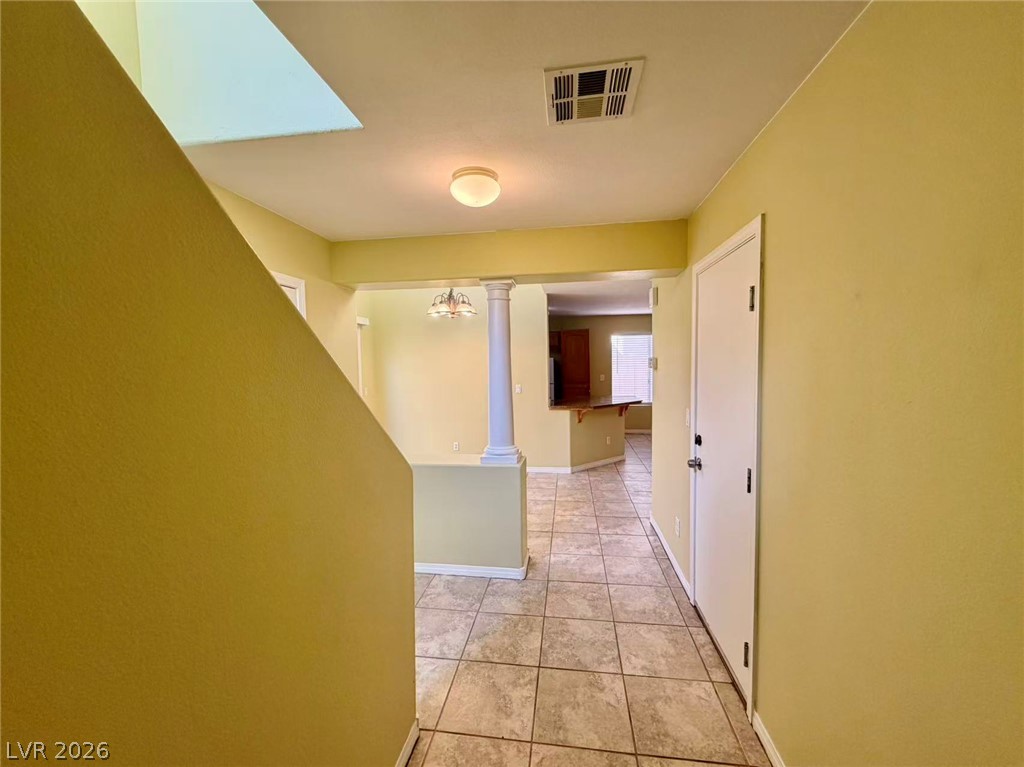 7326 Dicentra Road Las Vegas, NV 89113 - Photo 18 of 18 Durable tile flooring guides you from the entry into a welcoming, open floorplan.